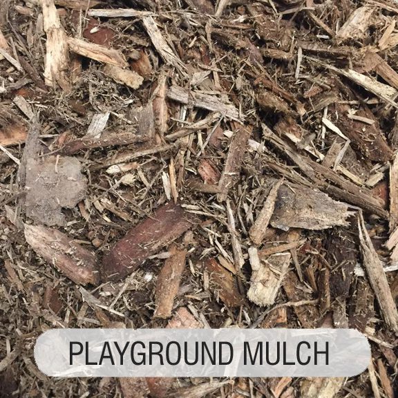 A pile of wood chips that are in the ground.