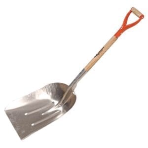 A shovel with an orange handle is leaning against the wall.
