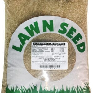 A bag of grass seed sitting on top of the ground.