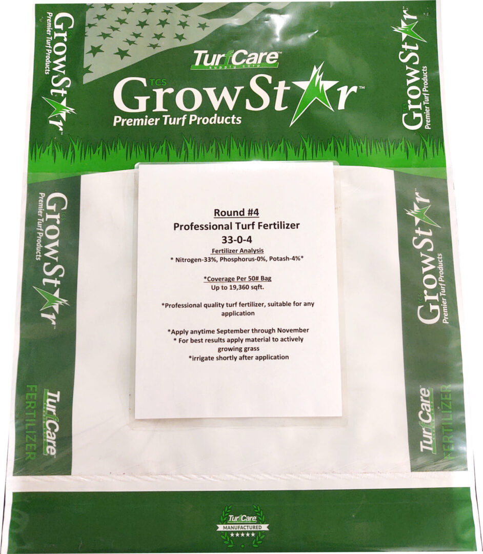 A package of grass seed that is on the ground.