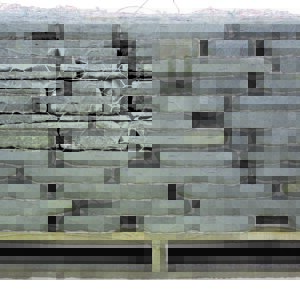 A pallet of stone blocks stacked on top of each other.
