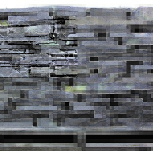 A pallet of black slate stone wall.
